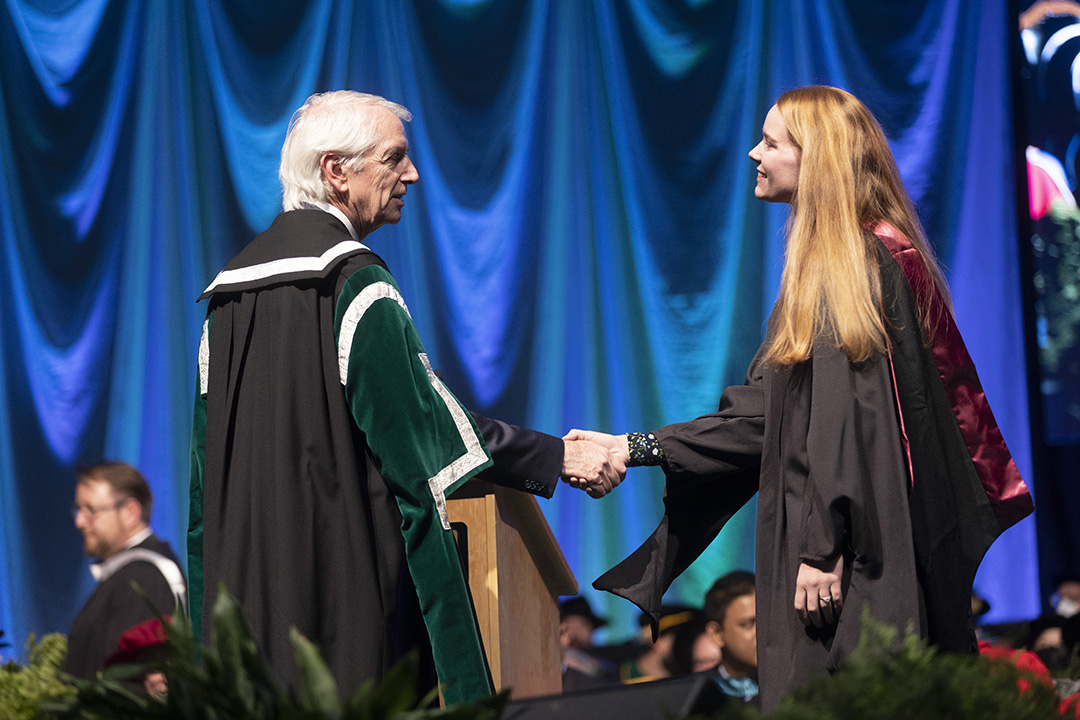 USask President Peter Stoicheff congratulates a student during Fall Convocation at Merlis Belsher Place on Nov. 9. 