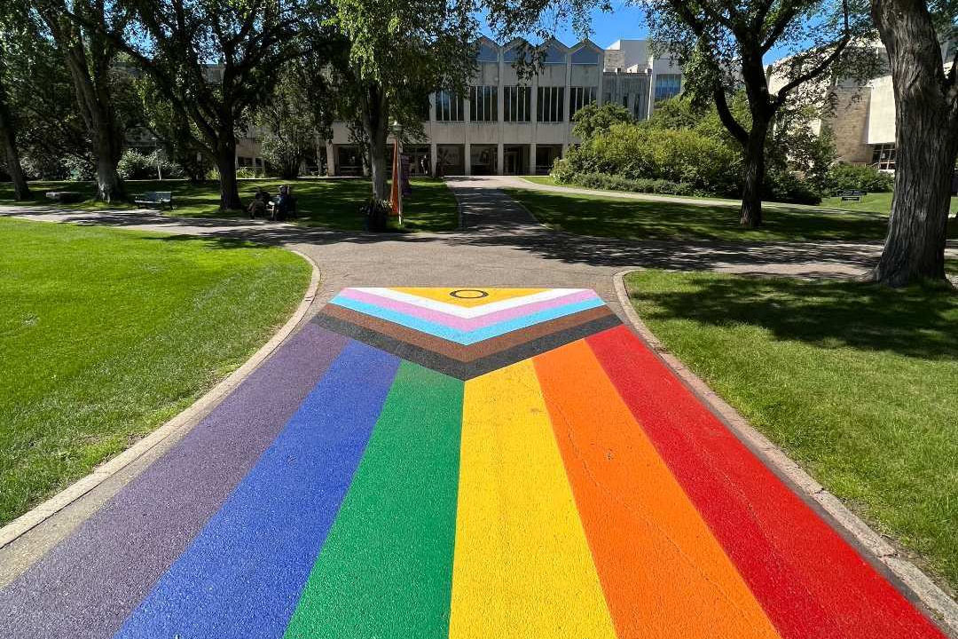 The Pride colours are painted on the sidewalk in the Bowl at the Saskatoon campus of the University of Saskatchewan. 