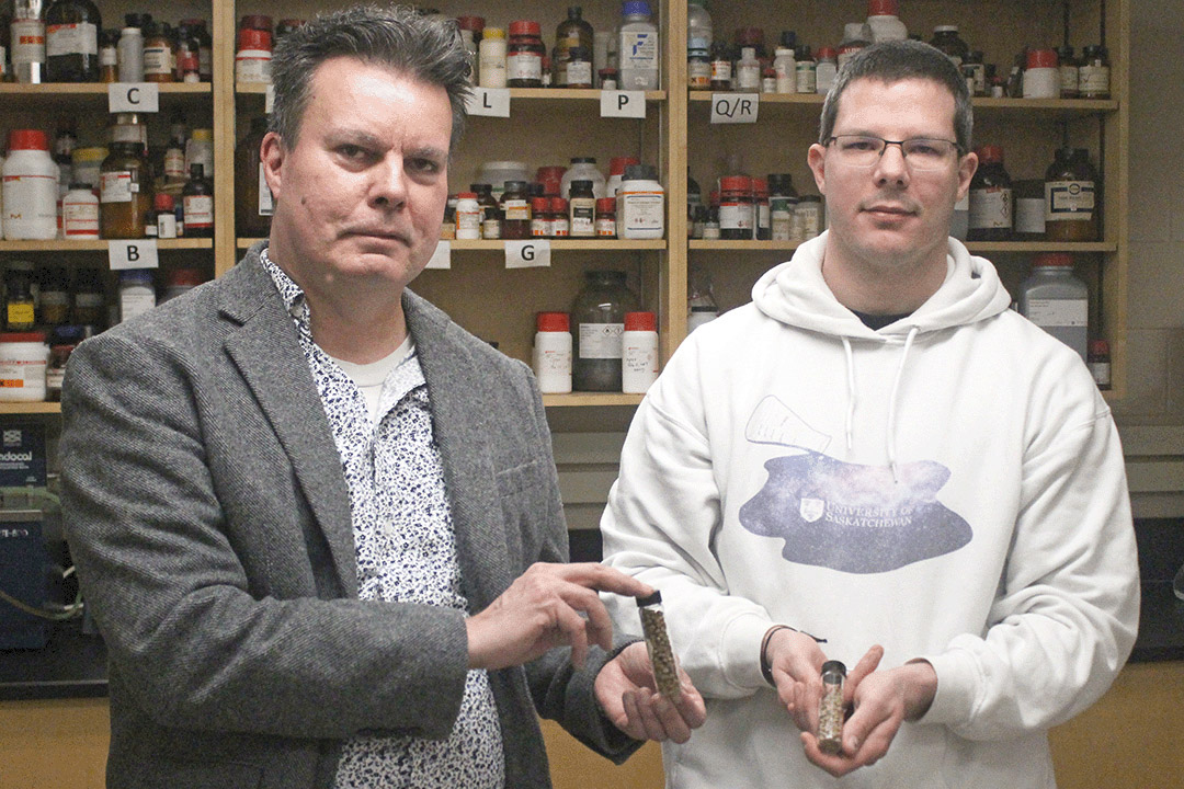 USask researcher and chemistry professor Dr. Lee Wilson (PhD'98), left, and PhD candidate Bernd Steiger hold bioplastic pellets designed to absorb contaminants in water. Photo by Kristen McEwen