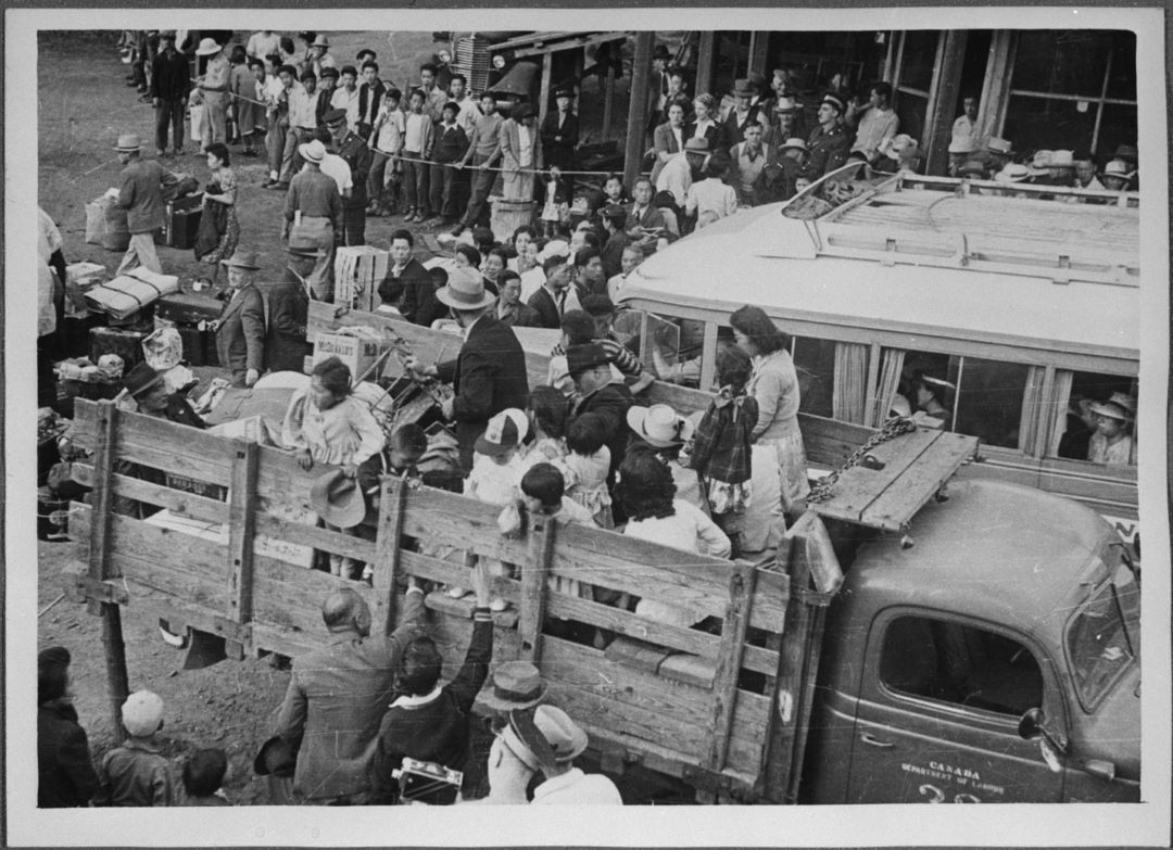 Group of Japanese Canadians being transported to camp at Slocan, British Columbia, 1942  (Credit: Tak Toyota, Library and Archives Canada, C-046350)