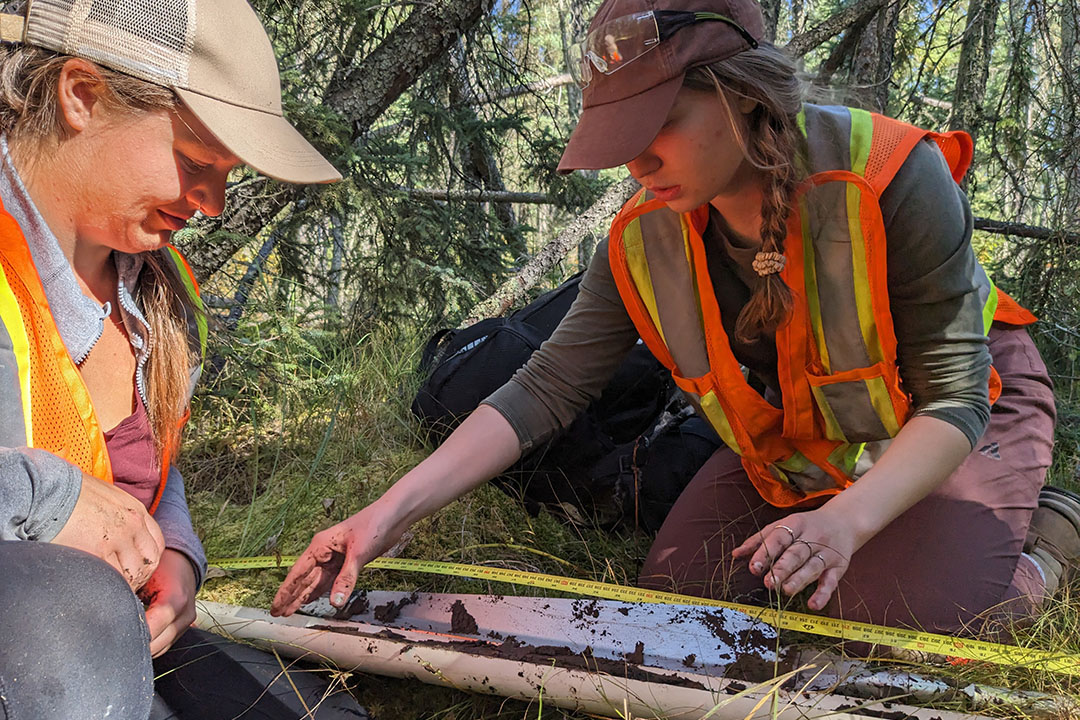 Students received hands-on learning experience by collecting peat samples to measure how much carbon was stored. (Photo: Submitted) 
