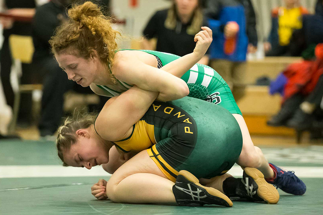 Huskies student-athlete Alex Schell (top) won her third straight national wrestling championship this year while completing the first year of her master’s program at USask. (Photo: Getmyphoto.ca)