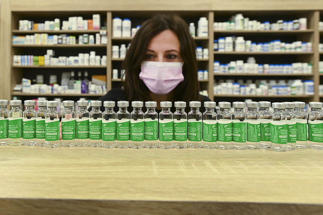 Pharmacist Barbara Violo arranges all the empty vials of the AstraZeneca COVID-19 vaccine that she has provided to customers at an independent pharmacy in Toronto. (Photo: THE CANADIAN PRESS/Nathan Denette)