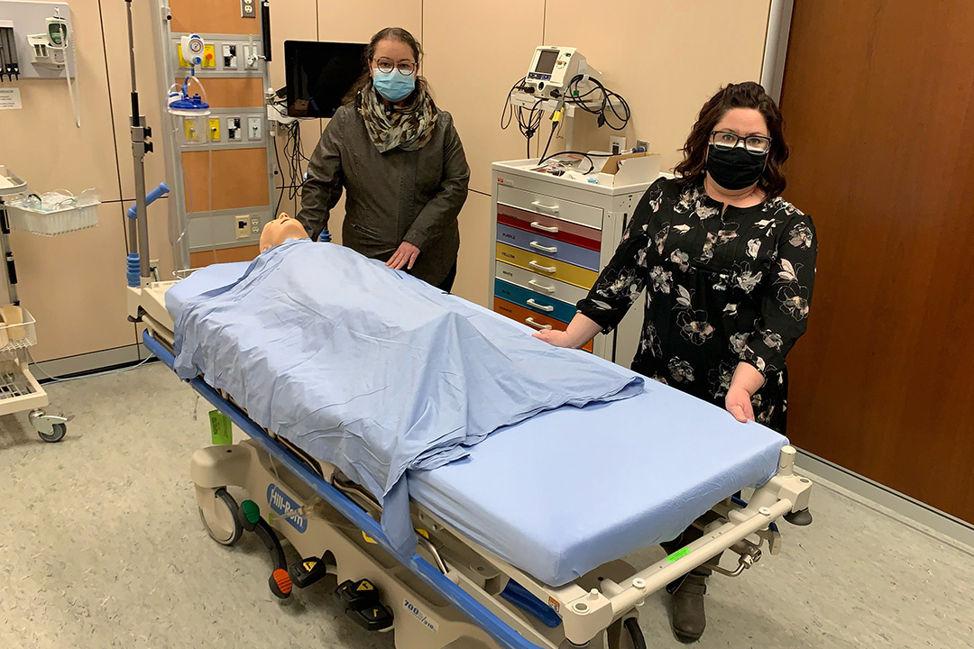 Dr. Mary Ellen Labrecque (PhD), on the left, and PhD candidate Michelle Pavloff in USask’s Clinical Learning Resource Centre. (Photo: College of Nursing)