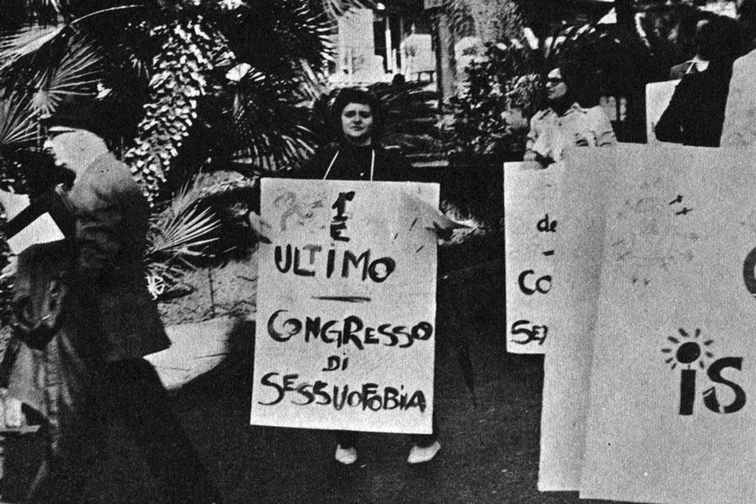 A protester holds a sign in Sanremo, Italy, during the country’s first public demonstration by the LGBT+ community in April 1972. April was chosen for LGBT+ History Month Italia in honour of that first protest. (Photo: Fuori! magazine, June 1972)