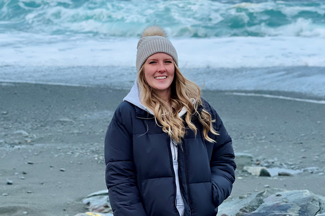 PhD student Kayla Wall poses outdoors during cold weather.