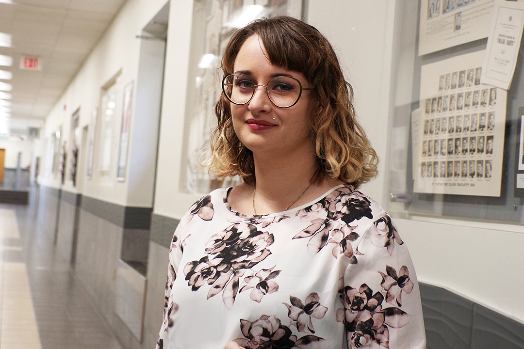A photo of Emily Roberts in the STM building at the University of Saskatchewan campus. 