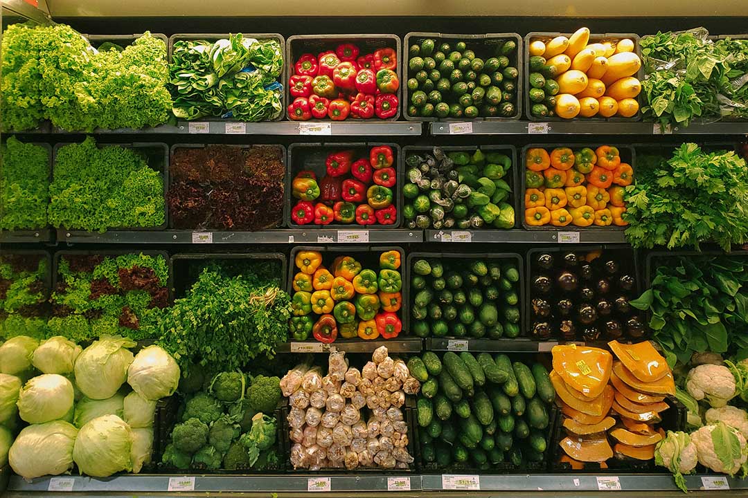 A photo of fresh food, including peppers and lettuce. 