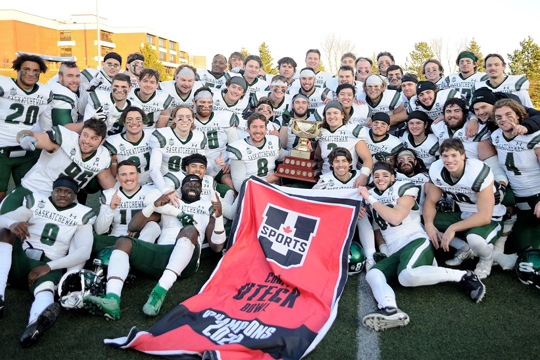 The USask Huskies football team celebrates a victory at the Uteck Bowl. 