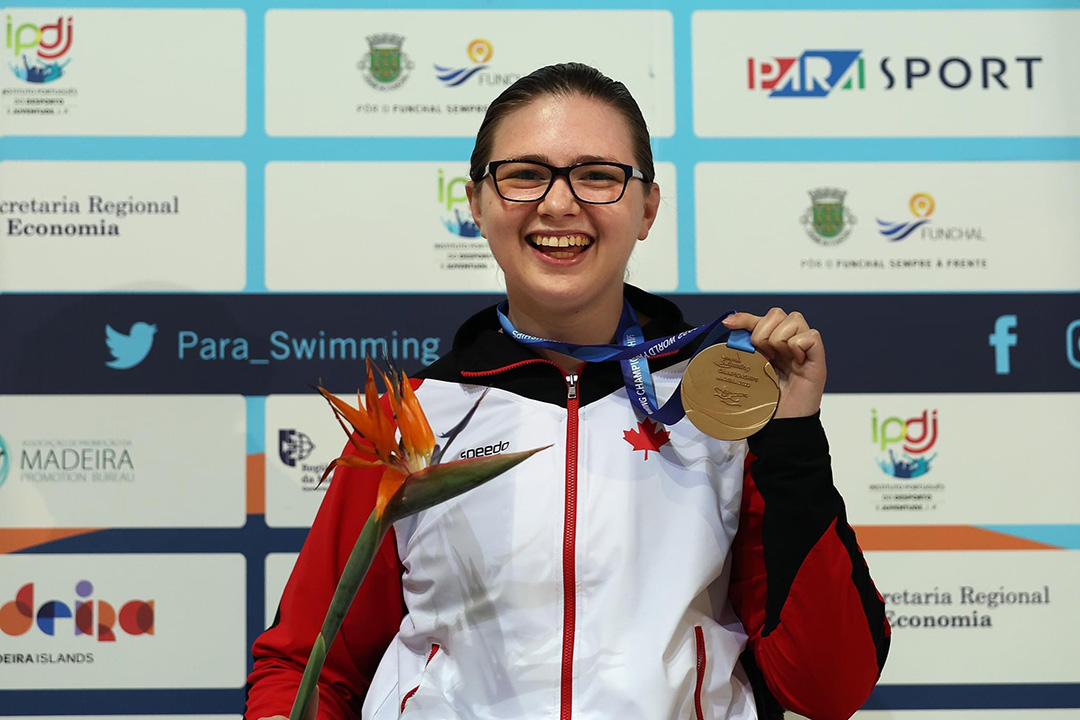 USask graduate Shelby Newkirk with her gold medal from the World Para Swimming Championships in Portugal.