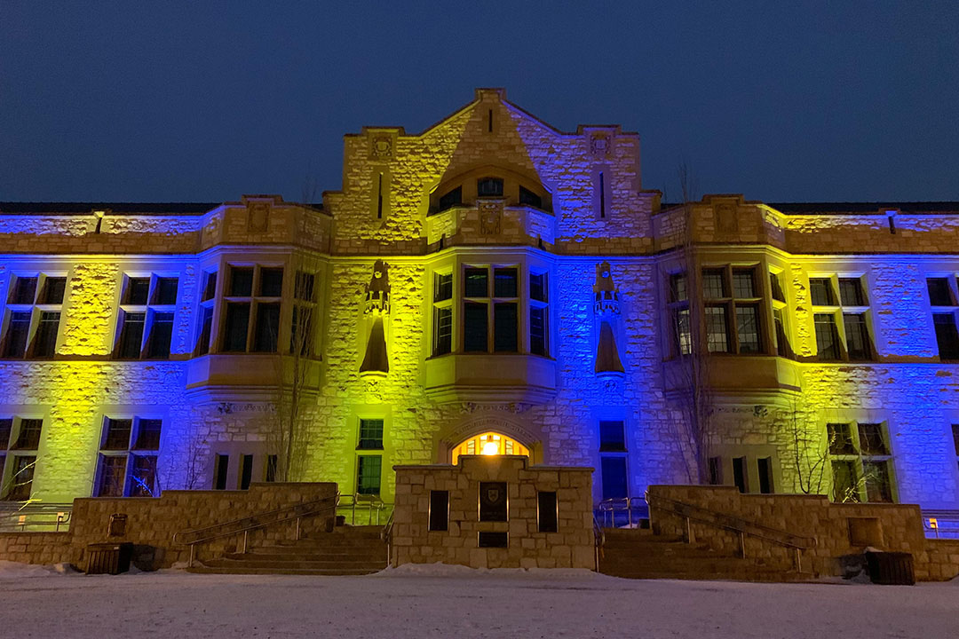 The USask-PMB building lit up in Ukrainian colours.
