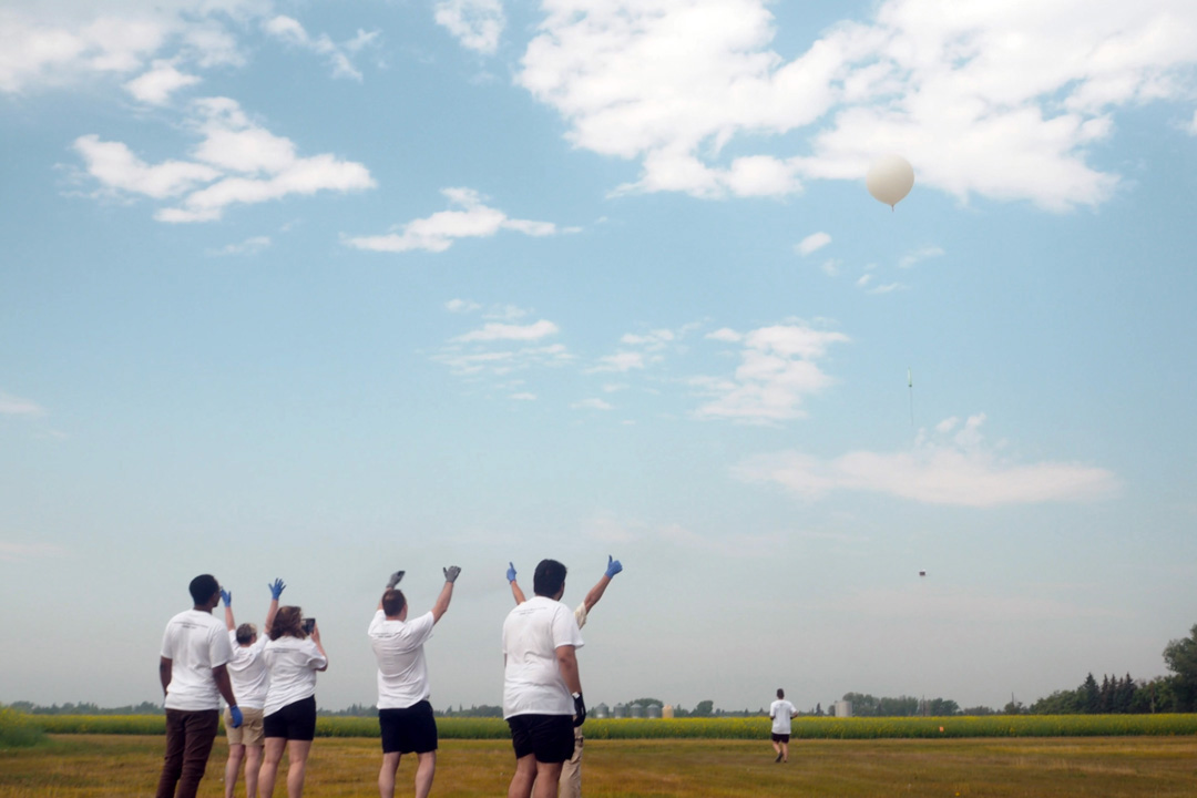 Participants in the 2023 International Space Mission training school at USask celebrate the launch of a stratospheric balloon near Cudworth, Sask., on July 25. (Photos/video: Chris Putnam)