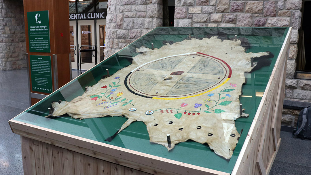 Circle of Life and Walking in Harmony with Mother Earth, by artist Robert (Bob) Badger, was installed in the E-Wing of USask’s Health Sciences Building in August 2022. Students, faculty, staff, and visitors within the building are able to learn more about the significance of the buffalo, mishkotay biziki, through this piece. (Photo: Collin Semenoff)