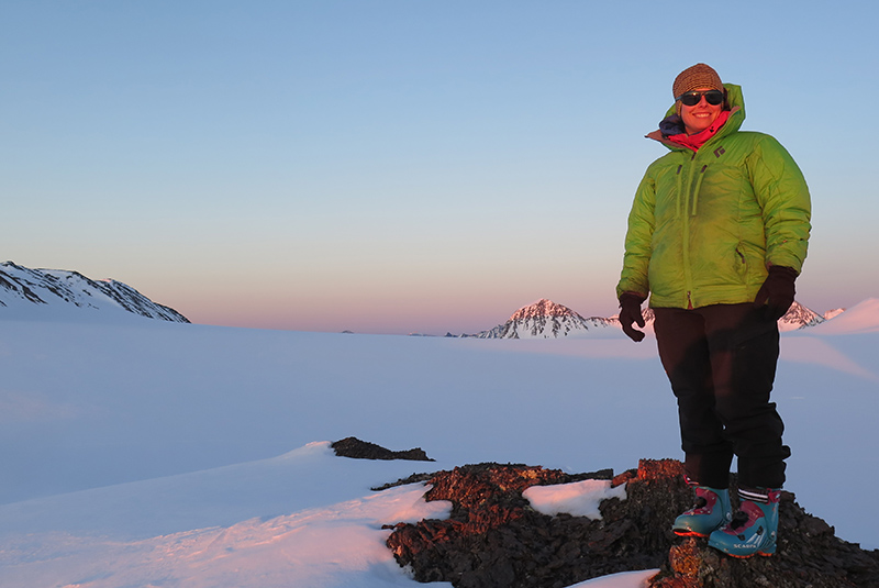 Caroline Aubry-Wake, PhD, standing on top of a mountain while conducting research. (Photo: Submitted)
