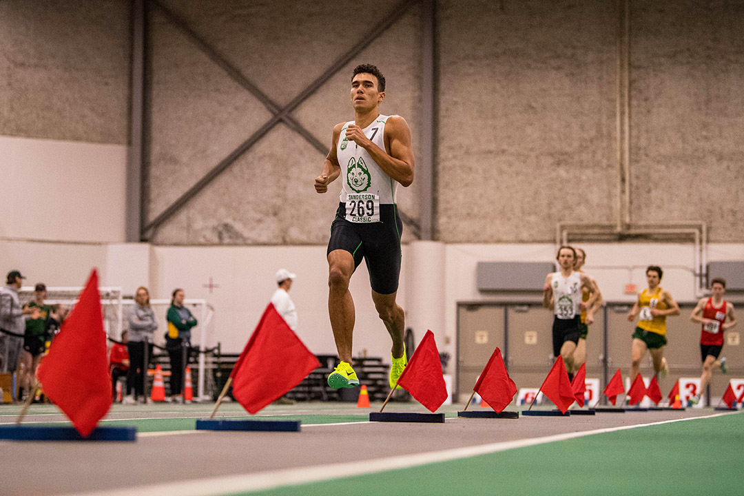 USask engineering student Dylan Bauman running during a track event at the Field House.