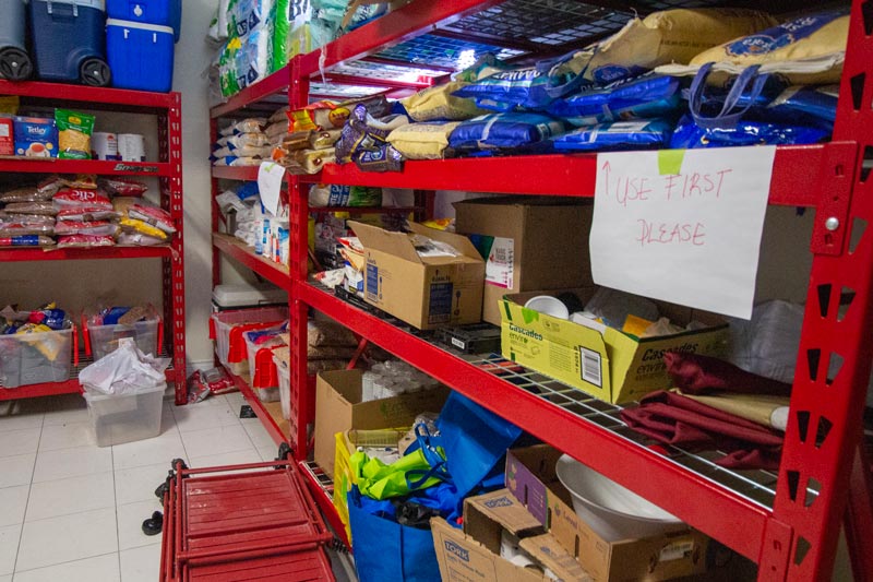 The gurudwara stores large amounts of food for community meals. A new inventory system helps avoid waste. 