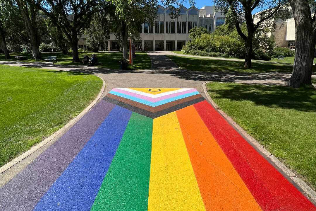 The Pride colours are painted on the sidewalk in the Bowl at the Saskatoon campus of the University of Saskatchewan. 