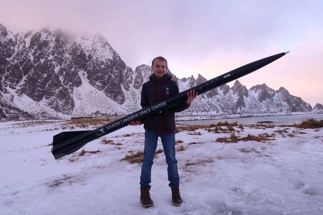 Dylan Haussecker holds a rocket he and an international team of students built at the 2020 CaNoRock program at the Andøya Space Center in Norway. (Photo: submitted)