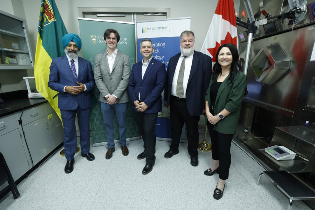 From left: Dr. Baljit Singh (PhD), Dr. Eric Price (PhD), Minister Jeremy Harrison, Dr. John Root (PhD), Kari Harvey. (Photo: David Stobbe for USask)