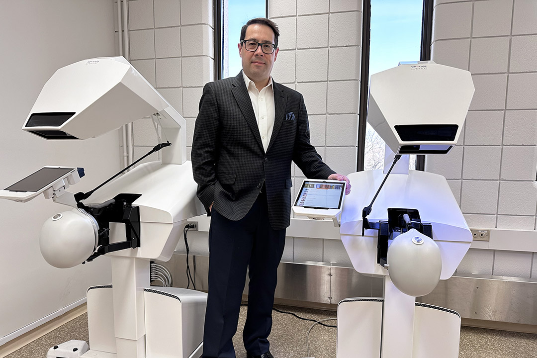 Dr. Walter Siqueira (DDS, PhD), dean of the College of Dentistry, with simulators in the college’s new Mixed Reality Patient Simulation Learning Space. (Photo: Duane Krip)