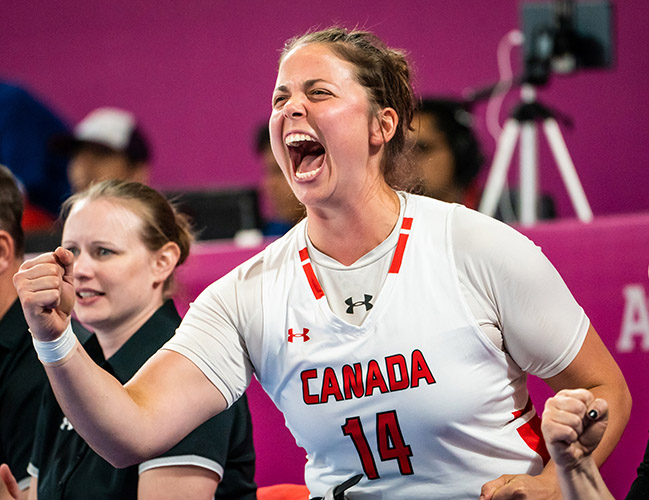 USask graduate and former Huskie women’s basketball player Erica Gavel helps cut down the net after Canada’s gold-medal performance at the 2019 Parapan American Games in Lima, Peru. (Photo: Wheelchair Basketball Canada)