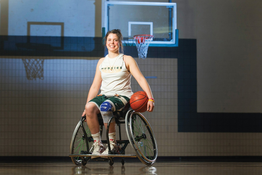 USask graduate and former Huskie women’s basketball player Erica Gavel helps cut down the net after Canada’s gold-medal performance at the 2019 Parapan American Games in Lima, Peru. (Photo: Wheelchair Basketball Canada)