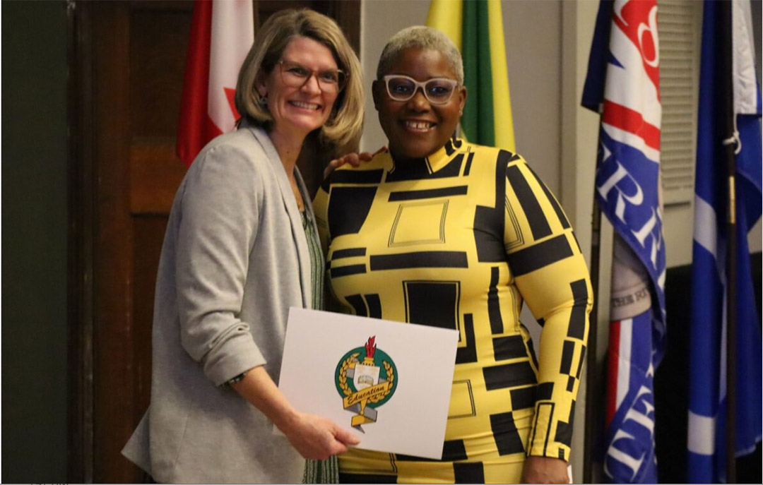 Dr. Julia Paulson (PhD), dean of the College of Education, presents Lecia Ellis with an award at the 2023/24 College of Education Academic Awards Celebration on Jan. 19, 2024. (Photo: Connor Jay)