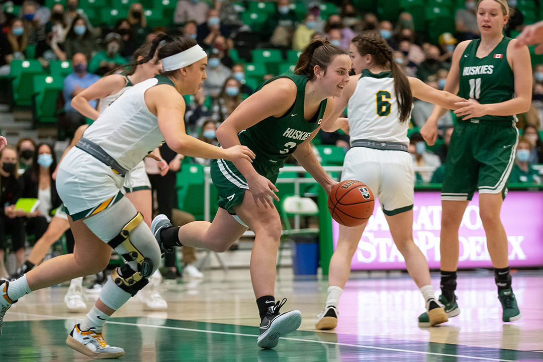 Carly Ahlstrom and the Huskie women’s basketball team starts the second half of the season with a perfect 10-0 record. (Photo: Electric Umbrella/Huskie Athletics)
