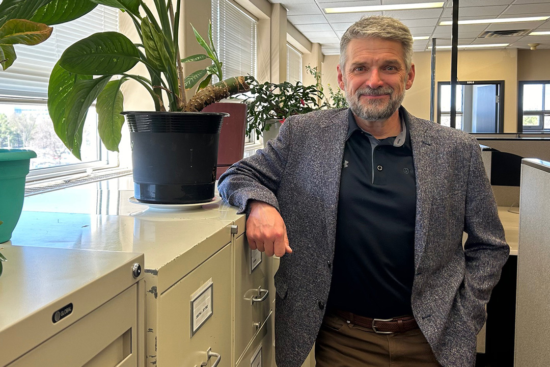 Michael Barr poses in an office at the University of Saskatchewan