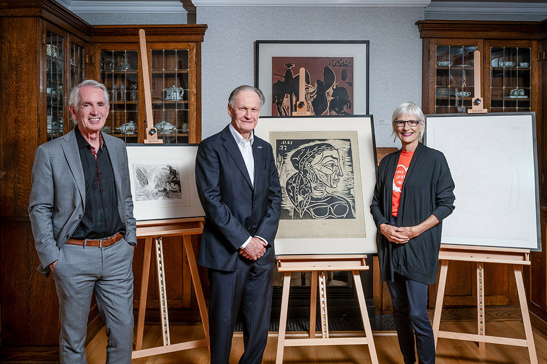 USask alumnus Dr. Frederick Mulder (PhD) and his donation of three prints by Pablo Picasso, with USask President Peter Stoicheff (left) and Kathryn Warden (right). (Photo: Matt Smith)