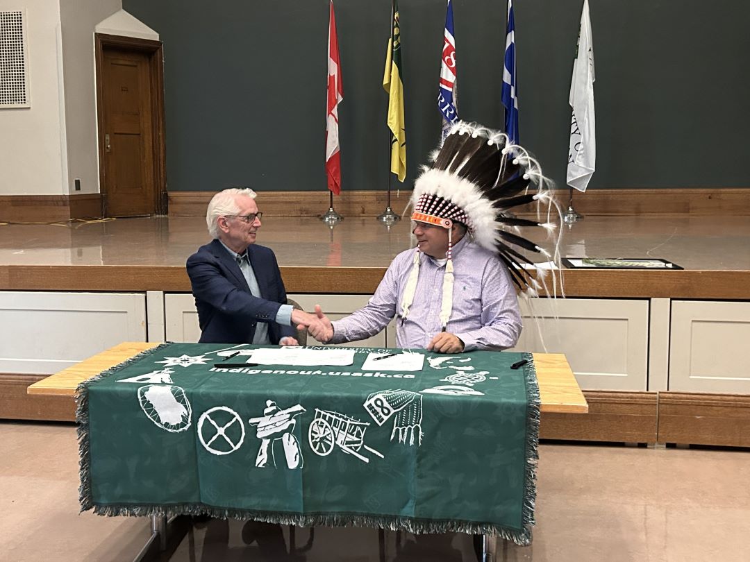 USask President Peter Stoicheff and Thunderchild First Nation Chief Delbert Wapass shake hands after signing a memorandum of understanding at Convocation Hall, Aug. 27, 2024