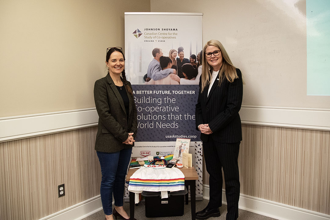 Co-operative Retailing System Chair in Co-operative Governance Dr. Dionne Pohler (PhD) and FCL CEO Heather Ryan inside the newly renamed Co-op Collaborative Room at USask