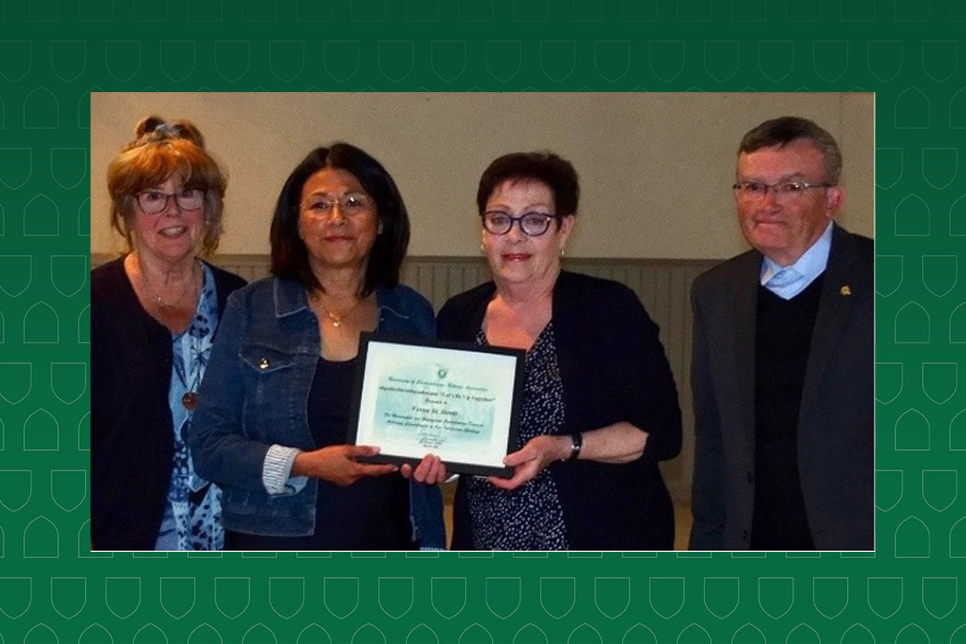 Verna St. Denis receiving award from board member Caroline   Cottrell, with co-presidents Merry Beazely and Jim Thornhill