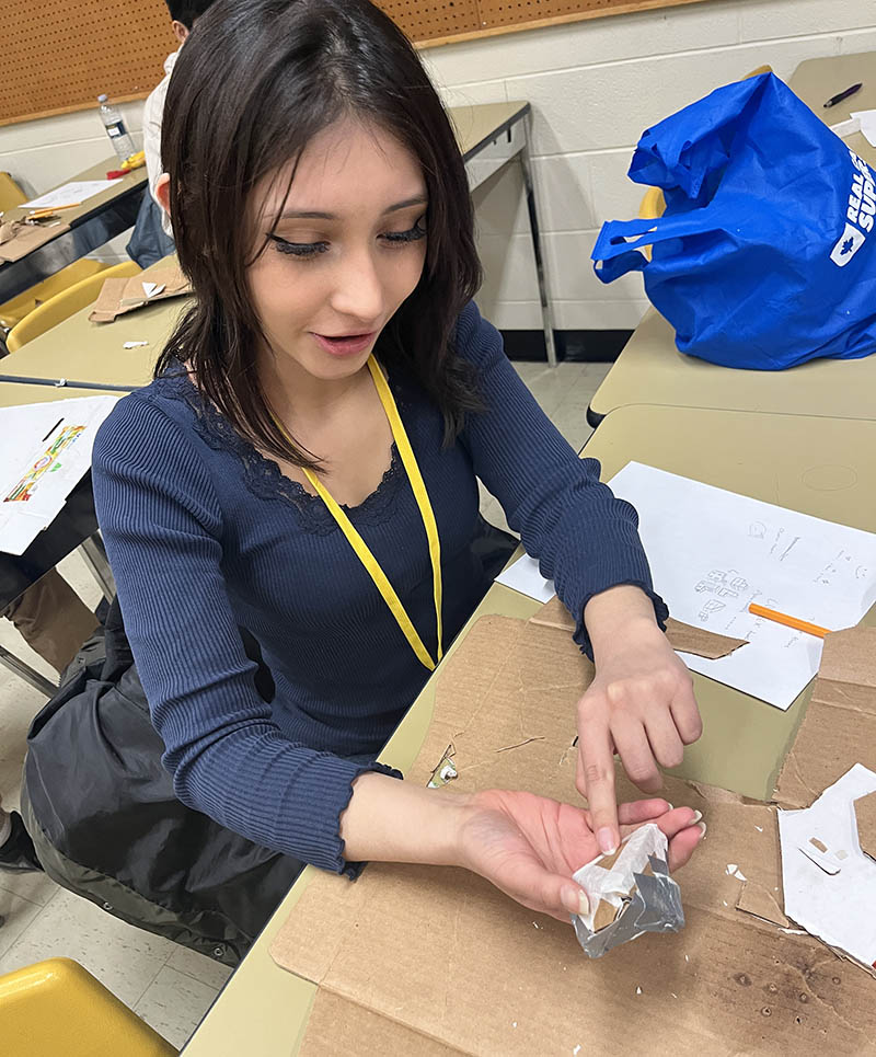 Tiana Morales Harmon with a plaster rock she moulded during a high school engineering camp. (Photo: Donella Hoffman)