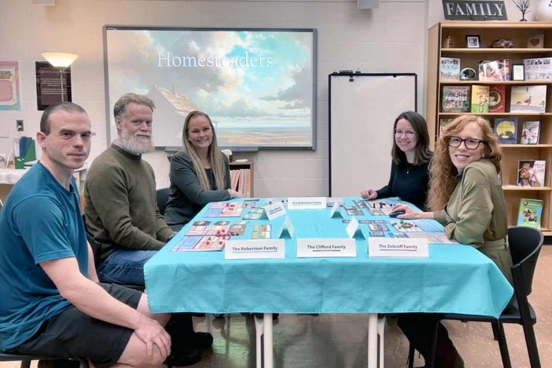 The game’s creators play a round of Homesteaders. (Photos: submitted)