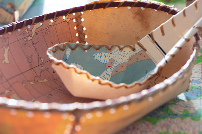 Visitors to the Gordon Snelgrove Gallery from March 3–7 can create baskets and other birchcraft-inspired artwork from discarded geologic maps. These examples were made by Sandy Bonny and Logan Martin-Arcand. (Photos: Chris Putnam)