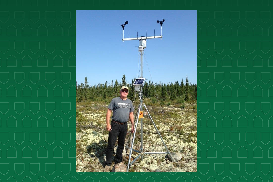 Dr. Bob Patrick (PhD) stands next to a weather station as part of his research in Wollaston Lake, with Hatchet Lake Dene Nation. (Photo: Submitted)