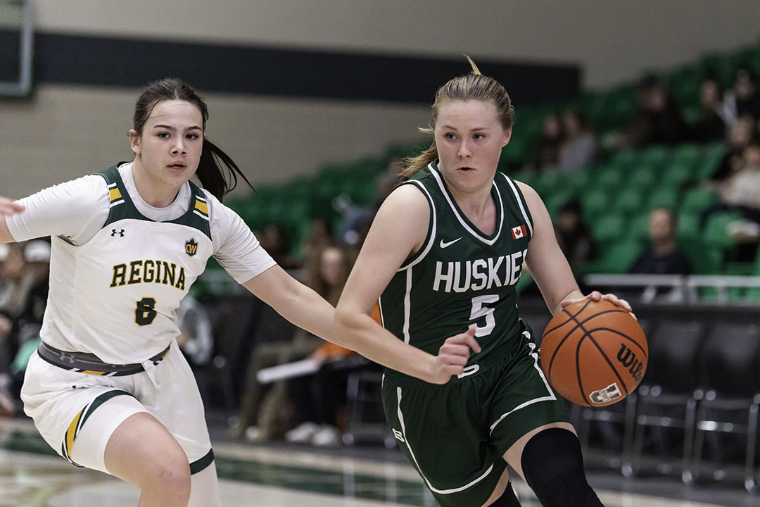 Huskies women’s basketball point guard Gage Grassick (right) was a second-team All-Canadian on the court as well as an Academic All-Canadian last season. (Photo: Huskie Athletics)