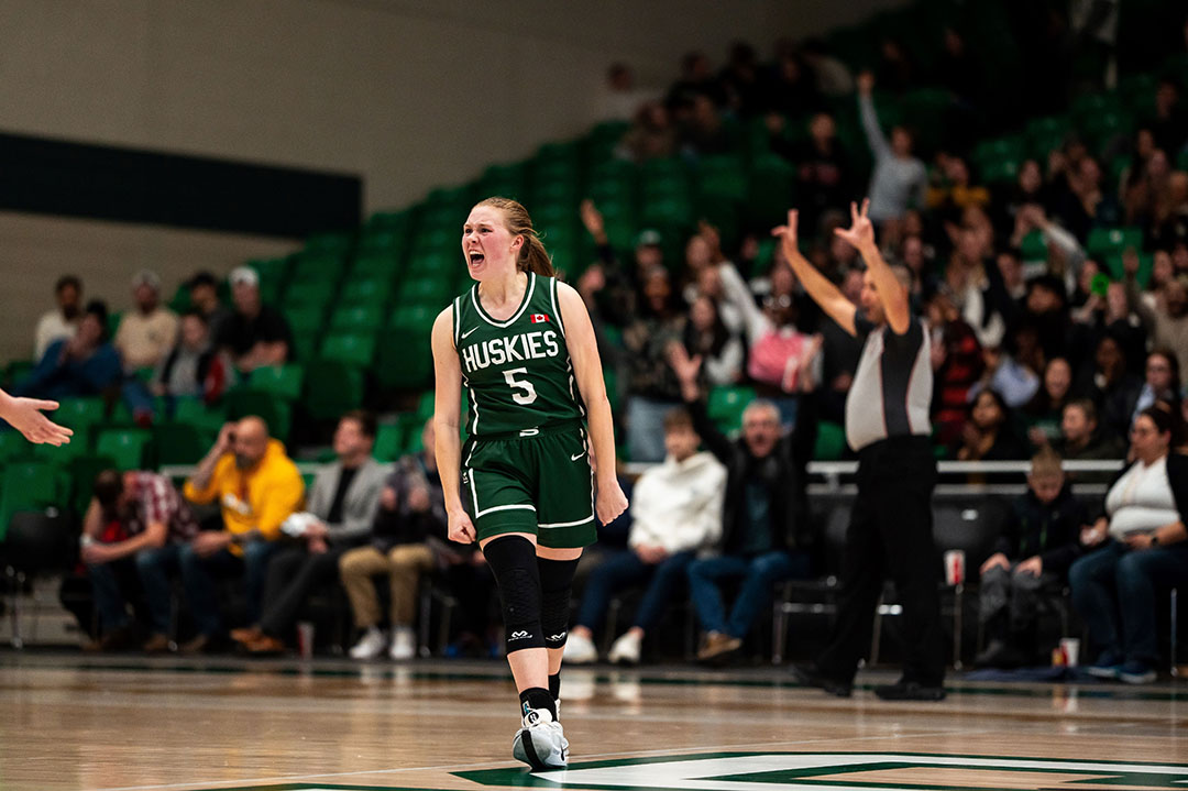 Huskies women’s basketball point guard Gage Grassick (right) was a second-team All-Canadian on the court as well as an Academic All-Canadian last season. (Photo: Huskie Athletics)