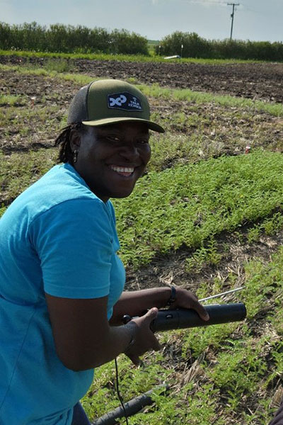 USask international graduate student Ifedolapo Adebara is studying chickpea roots to improve root disease tolerance in pulses. (Photo: Kira Glasscock)