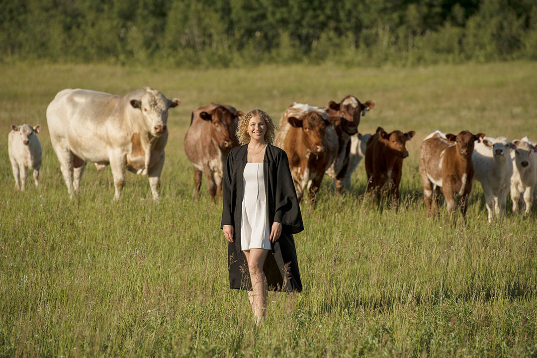 New USask graduate Jessica Davey with the Shorthorn cattle she raises on her family farm in Saskatchewan. (Photo: SJO Photo)