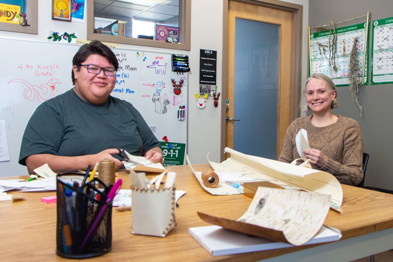 Visitors to the Gordon Snelgrove Gallery from March 3–7 can create baskets and other birchcraft-inspired artwork from discarded geologic maps. These examples were made by Sandy Bonny and Logan Martin-Arcand. (Photos: Chris Putnam)