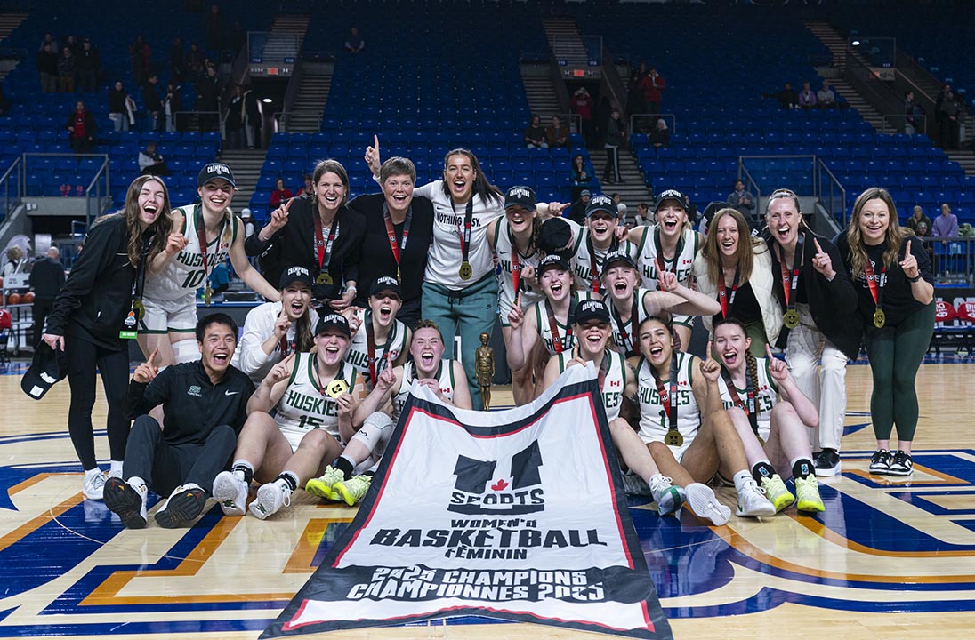 The University of Saskatchewan Huskie women’s basketball team celebrates its 2025 national championship victory on March 16. (Photo: Jacob Mallari/UBC Thunderbirds)