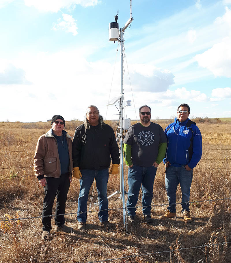 Dr. Bob Patrick (PhD) stands next to a weather station as part of his research in Wollaston Lake, with Hatchet Lake Dene Nation. (Photo: Submitted)