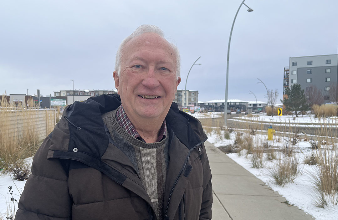 USask’s Greg Oster of the Department of Computer Science holds one of the rolls of plastic that was on hand a quarter of a century ago in case needed to wrap and protect computer equipment during Y2K. (Photo: Kristen McEwen)