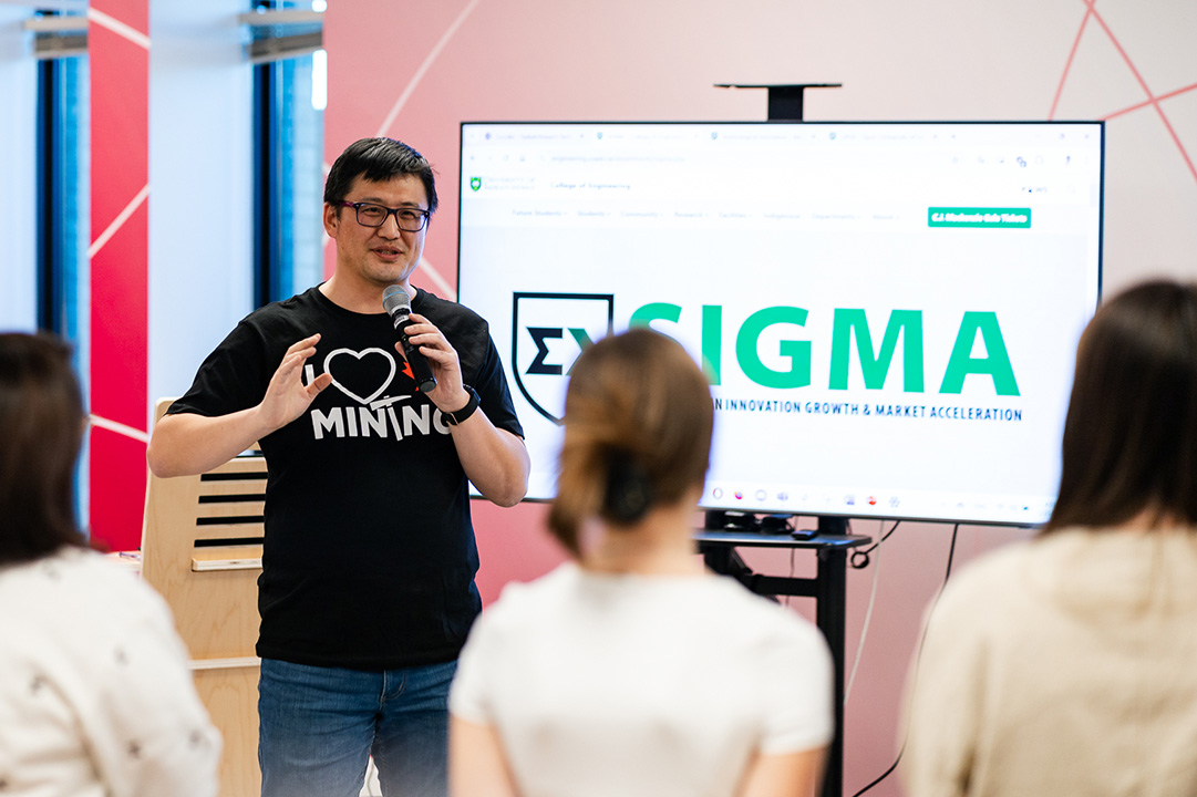 Tate Cao presenting at a mining hackathon last year. (Photo: Josh Buddhanlal, Darkstrand Visuals)
