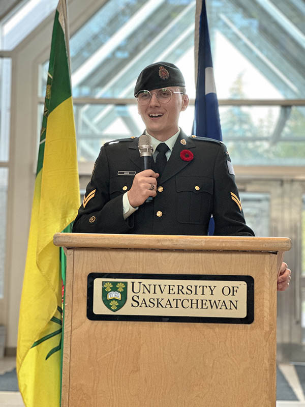 Dr. Angela Bedard-Haughn (PhD), dean of the College of Agriculture and Bioresources (front), Corporal Fikret Ükis (centre) and Major Shelly Bellisle (back) lay a wreath and potted poppies in the Agriculture Building on Tuesday. (Photo: Kira Glasscock)