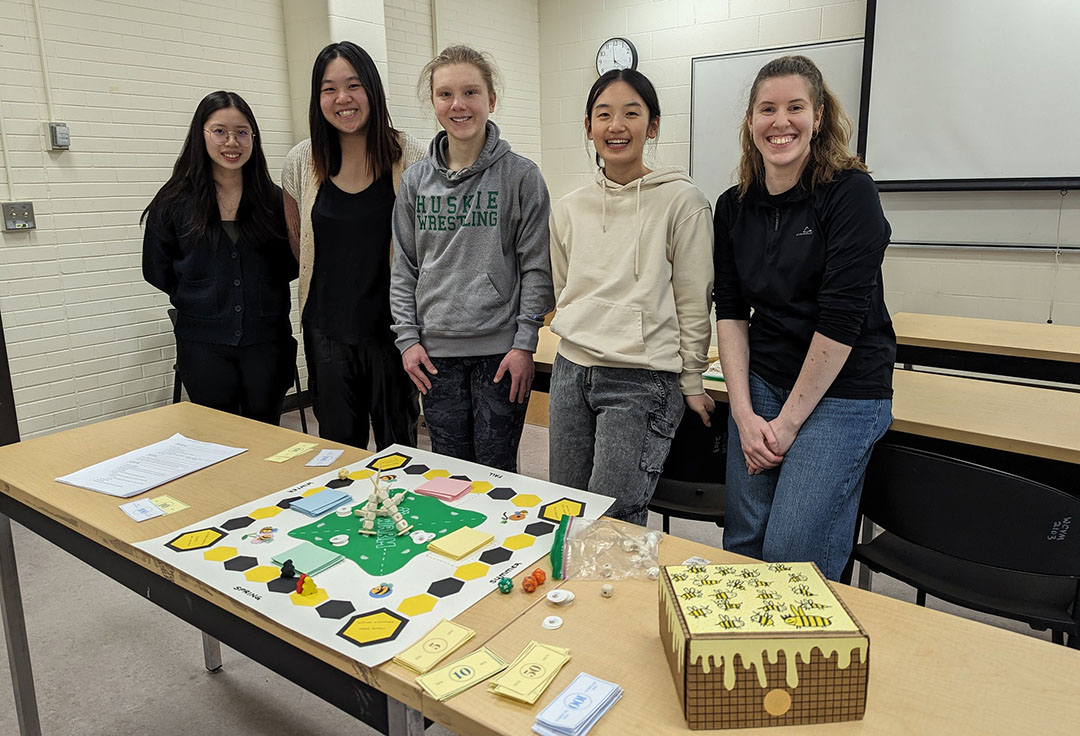 Left to right: WCVM students Zihan Li, Kyona Bruns, Samantha Nixon and Kree Byrne play their honey bee version of Settlers of Catan. (Photo: Rigel Smith)