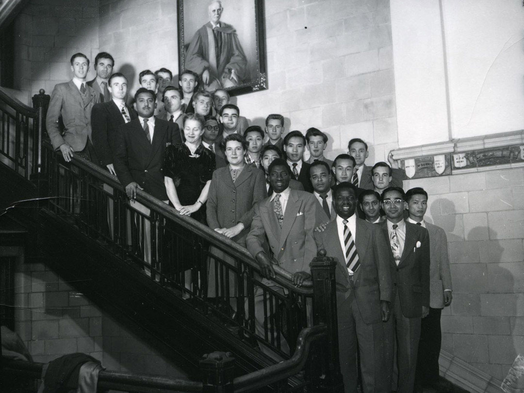 In 1963, PhD candidate Norman McDuffie (in suit), works with fellow researchers in the post-graduate tissue culture course, at the University of Saskatchewan. (Photo: University Archives A-3952)