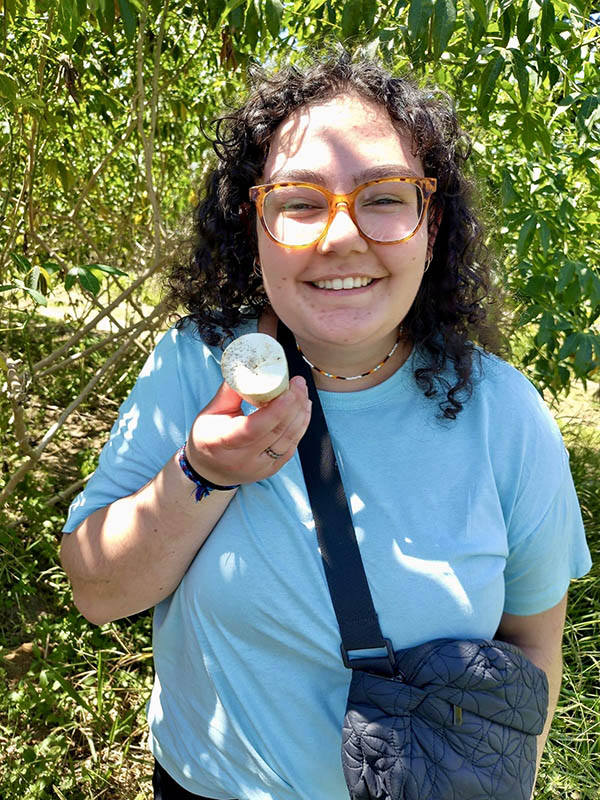 Emily Sebastian sweep netting in canola at her summer student job. (Photo: Sparrow Acres Photography)